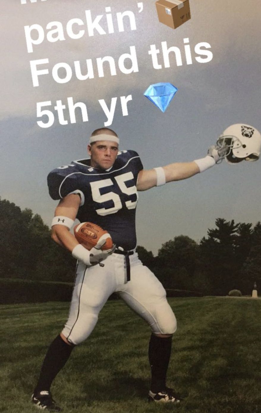 David McMahon in a Butler football uniform, number 55, holding a football and his helmet.